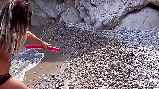 Stunning French ladies share a hard cock on the beach