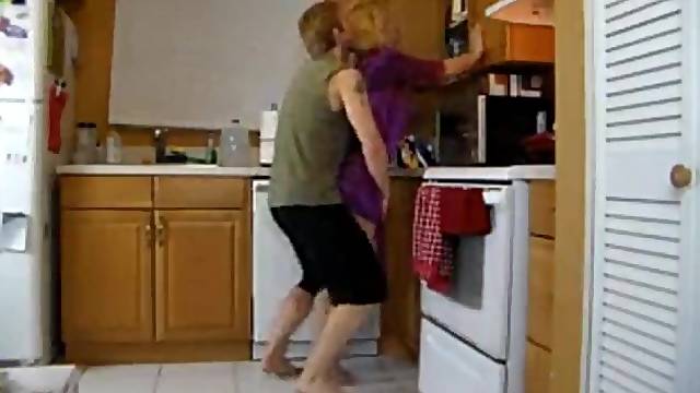 Hawt golden-haired woman got screwed in the kitchen, not knowing about a hidden camera there