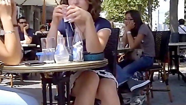Brunette in a summer café teasing