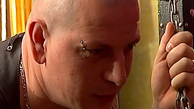 Tattooed Dom Fists Mature Blonde in Chains